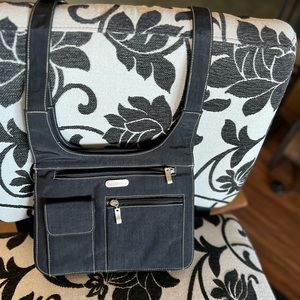 Black Baggallini crossbody bag with hidden card slots and zipper pockets